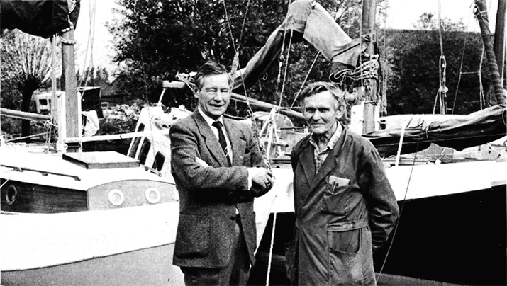 Wil (left) and Arnold Valentijn in front of two Groningen scows